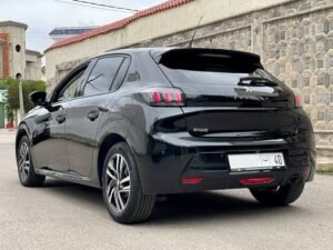 Our black Peugeot 208 rental car in Errachidia, rear view
